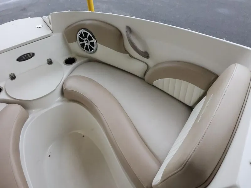 Slide: The Image of 2015 Stingray 198LX boat interior with beige seating and speaker. - 22