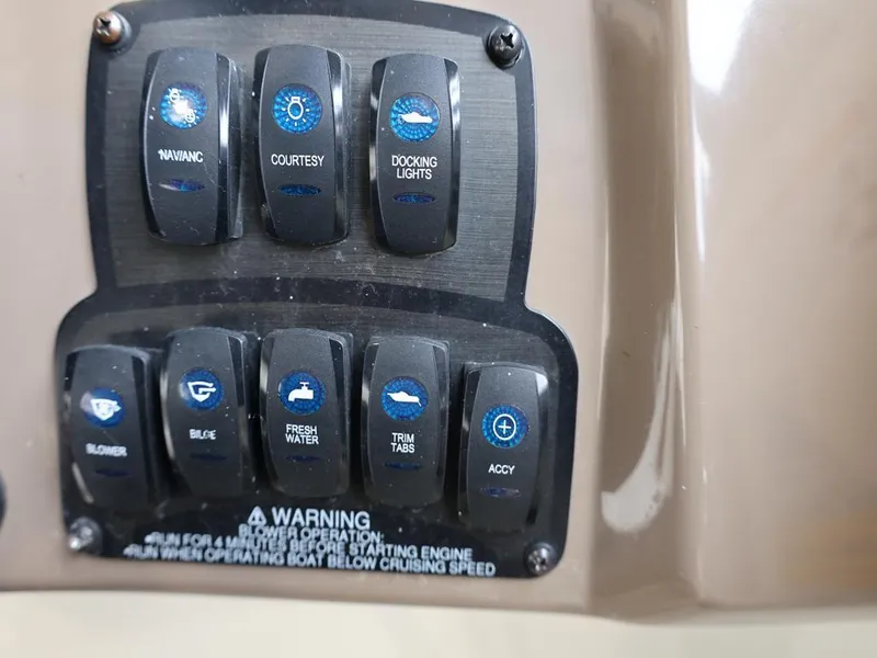 Slide: The Image of Control panel of a 2015 Stingray 198LX boat with labeled switches. - 28
