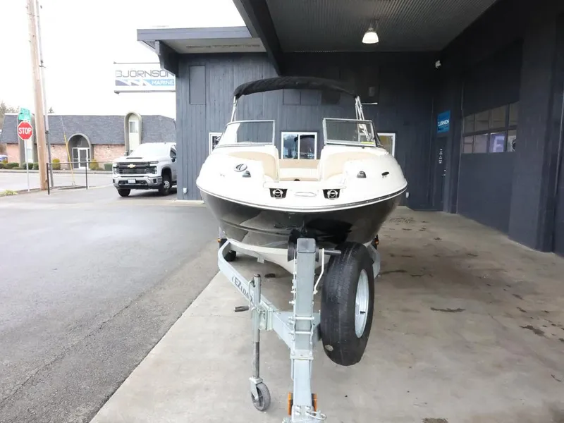 Slide: The Image of 2015 Stingray 198LX boat on trailer in a covered area. - 3
