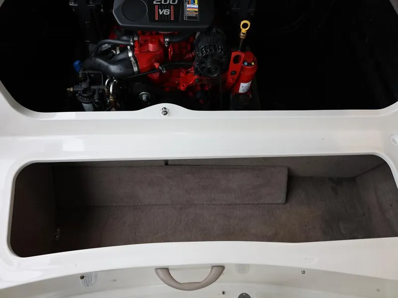 Slide: The Image of 2015 Stingray 198LX engine compartment with V6 engine and storage area. - 36