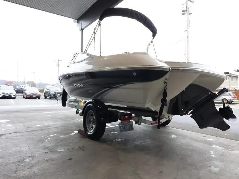 Slide: The Image of 2015 Stingray 198LX boat on trailer in covered area, rear view. - 6
