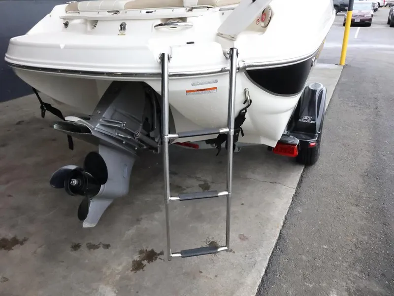 Slide: The Image of 2015 Stingray 198LX boat rear view with ladder and propeller on trailer. - 9