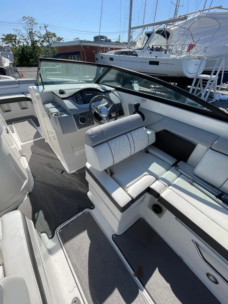 Slide: The Image of 2016 Sea Ray 290 Sundeck interior with modern helm and seating. - 11