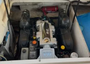 Slide: The Image of Engine compartment of a 2016 Sea Ray 290 Sundeck boat, featuring a V8 engine. - 5