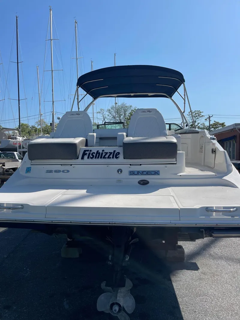 Slide: The Image of 2016 Sea Ray 290 Sundeck boat with canopy, docked in marina. - 9