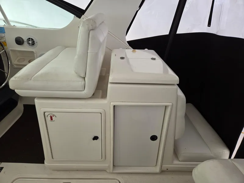 Slide: The Image of 2002 Tiara Yachts 3500 Open Hardtop interior seating and storage area. - 12