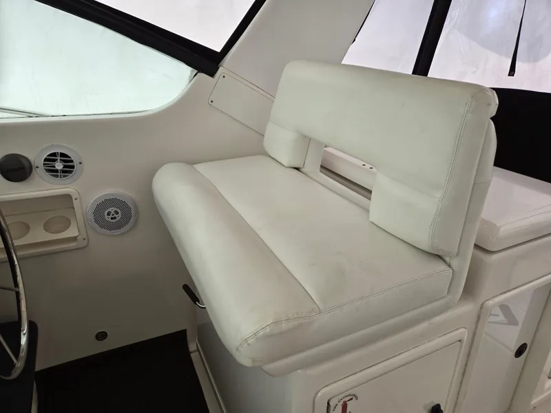 Slide: The Image of White seating area inside a 2002 Tiara Yachts 3500 Open Hardtop boat. - 13