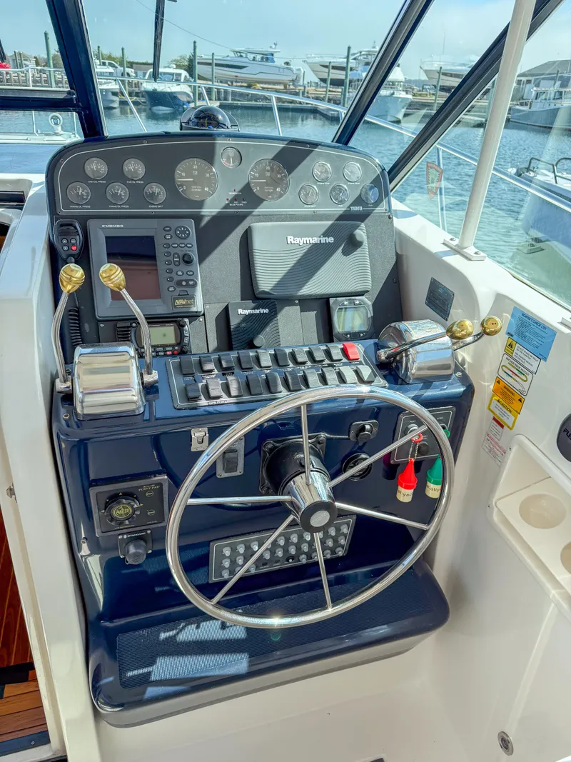 Slide: The Image of Control panel of a 2002 Tiara Yachts 3500 Open Hardtop, featuring navigation instruments. - 20