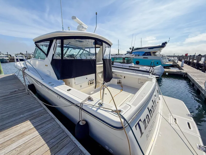 Slide: The Image of 2002 Tiara Yachts 3500 Open Hardtop docked at marina, rear view. - 3