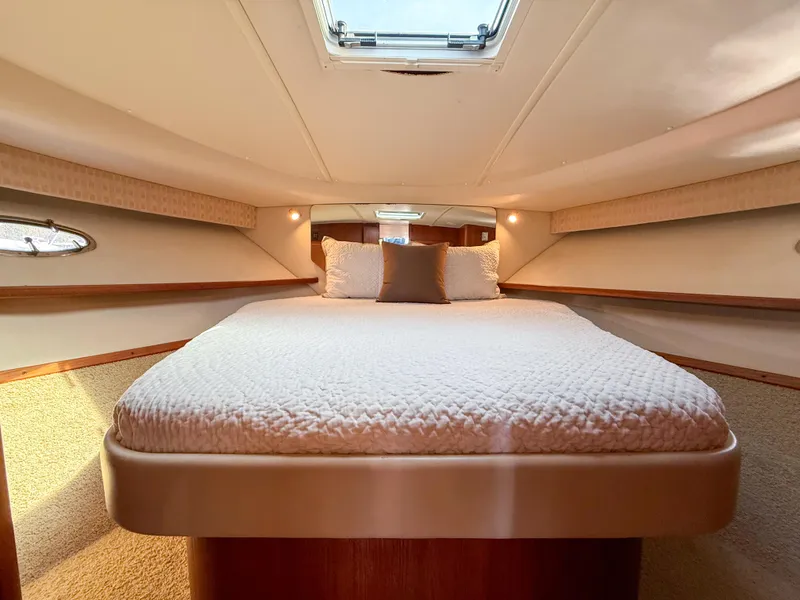 Slide: The Image of 2002 Tiara Yachts 3500 Open Hardtop cabin with cozy bed and elegant interior. - 32