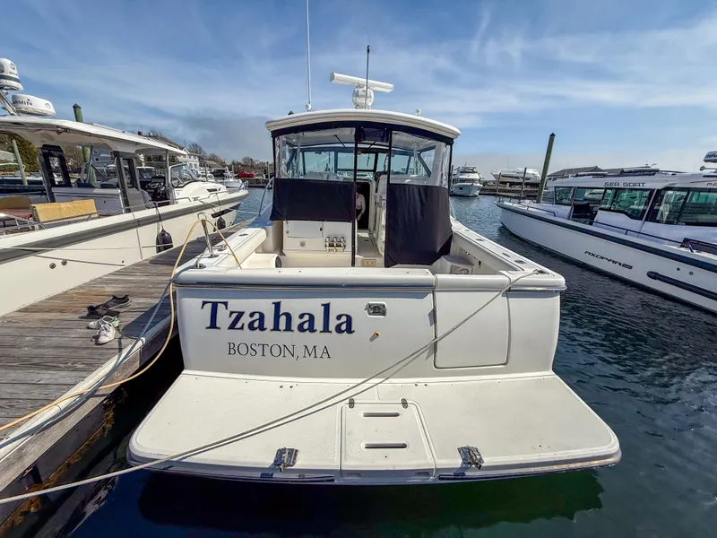 Slide: The Image of 2002 Tiara Yachts 3500 Open Hardtop docked in Boston marina. - 4