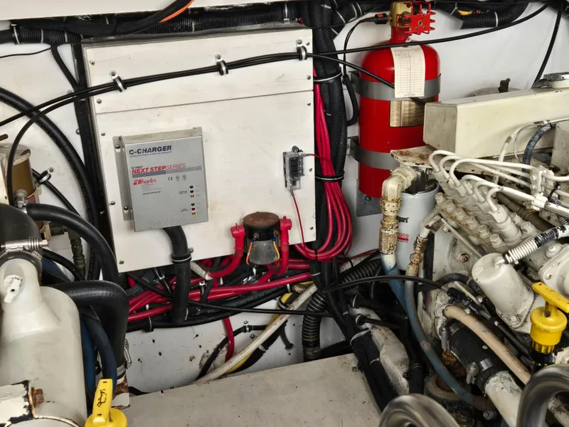 Slide: The Image of Engine room of 2002 Tiara Yachts 3500 Open, featuring wiring and fire extinguisher. - 40