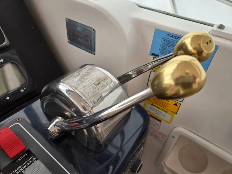 Slide: The Image of Throttle controls on a 2002 Tiara Yachts 3500 Open boat dashboard. - 43