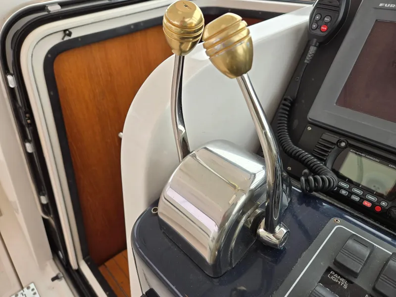 Slide: The Image of Throttle controls on a 2002 Tiara Yachts 3500 Open boat dashboard. - 44