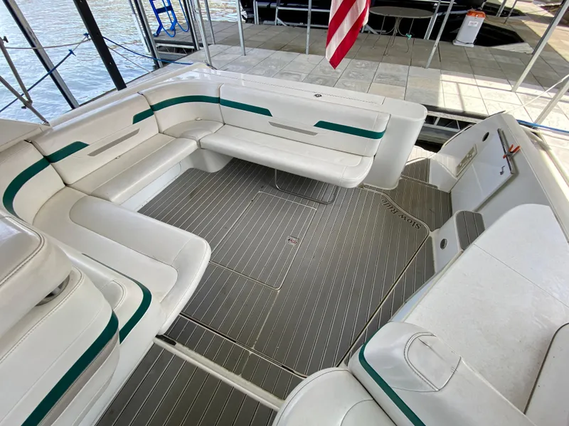 Slide: The Image of 1998 Formula 41 PC boat interior with white seating and green accents. - 12