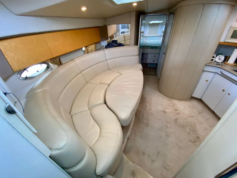 Slide: The Image of Luxurious interior of a 1998 Formula 41 PC yacht with curved leather seating. - 18