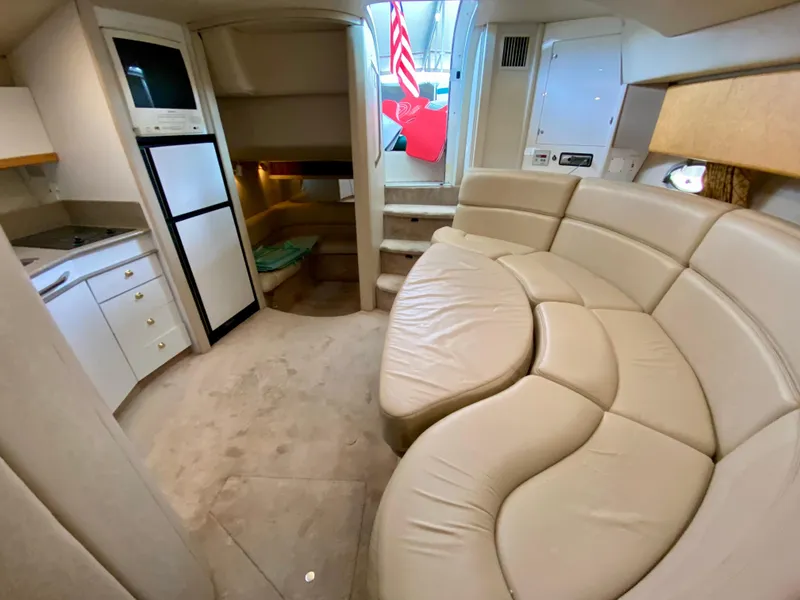 Slide: The Image of Luxurious interior of a 1998 Formula 41 PC yacht with plush seating and kitchenette. - 23