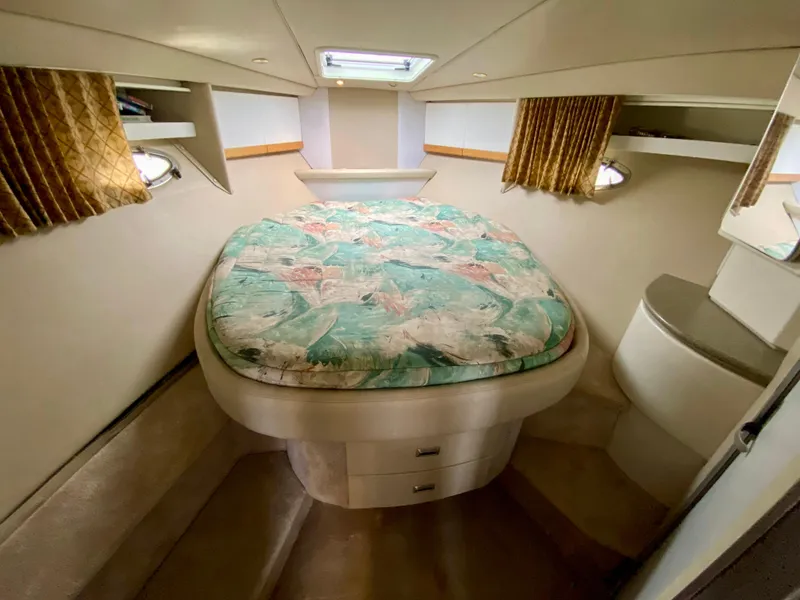 Slide: The Image of 1998 Formula 41 PC cabin interior with bed, storage, and portholes. - 24