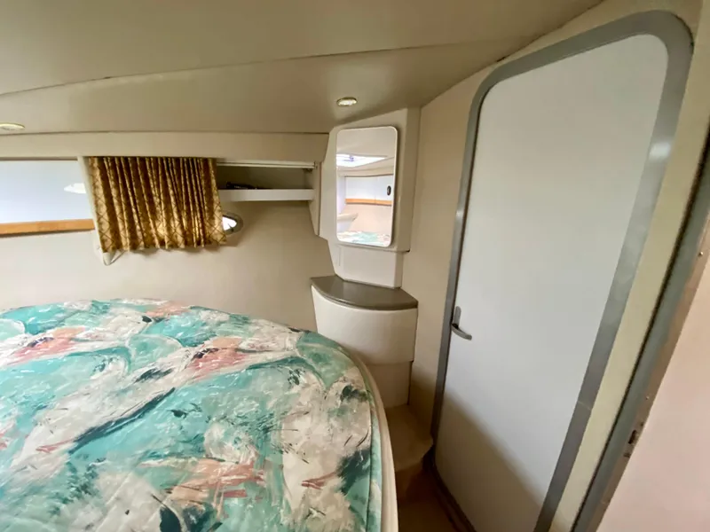 Slide: The Image of 1998 Formula 41 PC cabin interior with bed, mirror, and door. - 25