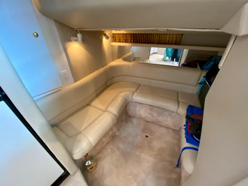 Slide: The Image of Interior of 1998 Formula 41 PC yacht with beige leather seating and ambient lighting. - 27