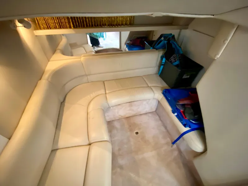 Slide: The Image of Interior of 1998 Formula 41 PC yacht with beige leather seating and storage. - 28