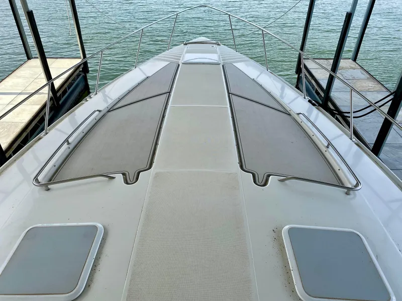 Slide: The Image of 1998 Formula 41 PC boat deck view, docked on calm water. - 4