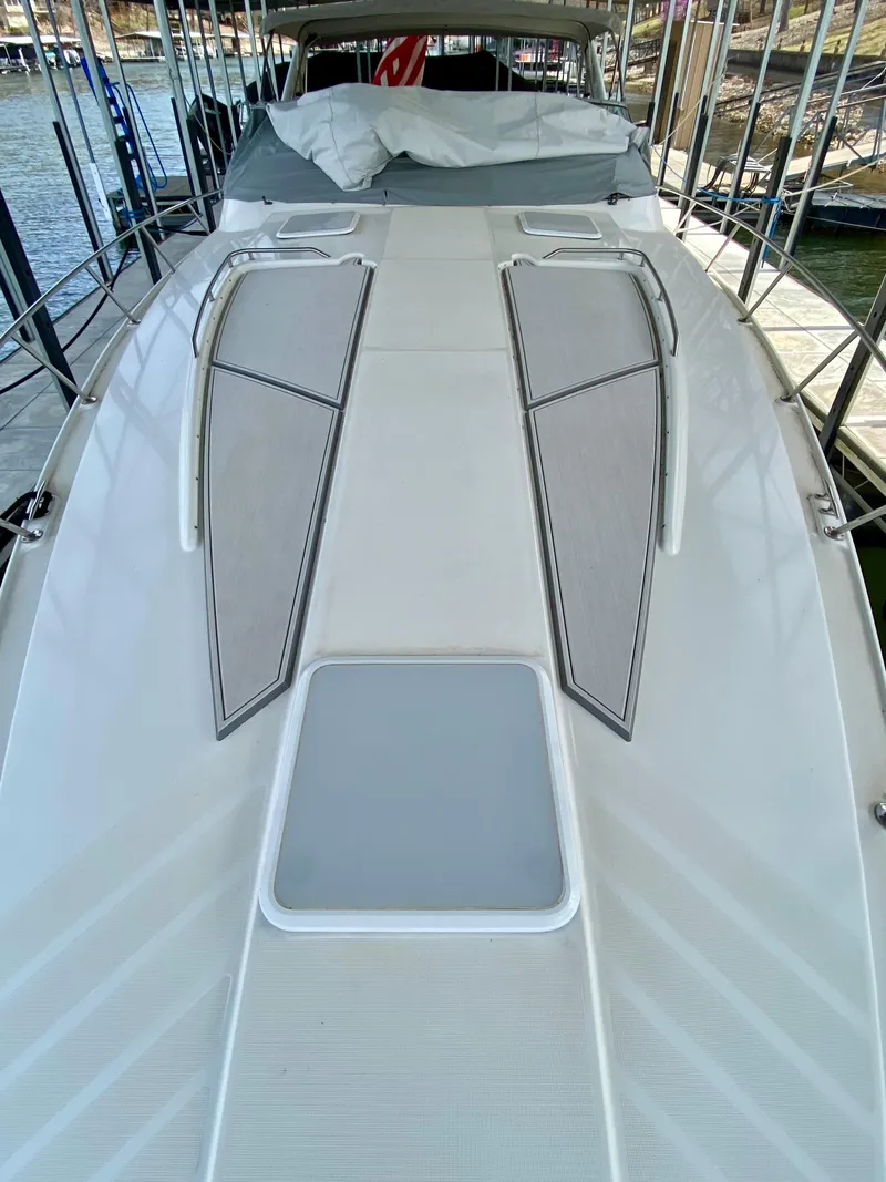 Slide: The Image of 1998 Formula 41 PC yacht deck with sleek design and cushioned seating. - 5