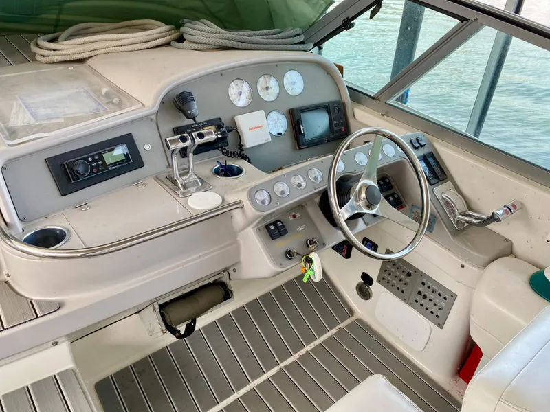 Slide: The Image of 1998 Formula 41 PC boat cockpit with steering wheel, gauges, and control panel. - 6