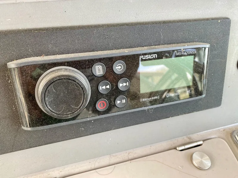 Slide: The Image of Fusion marine stereo system on a 1998 Formula 41 PC boat dashboard. - 8