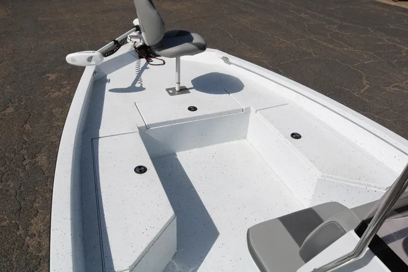 Slide: The Image of 2022 Xpress H22B boat interior with seating and storage compartments. - 11