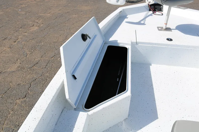 Slide: The Image of Open storage compartment on 2022 Xpress H22B boat deck. - 14