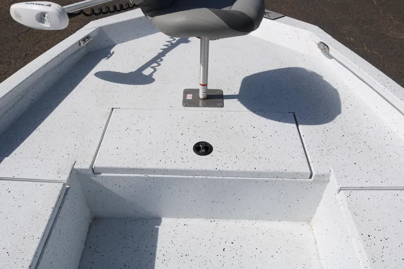 Slide: The Image of 2022 Xpress H22B boat interior with seating and storage compartment. - 15