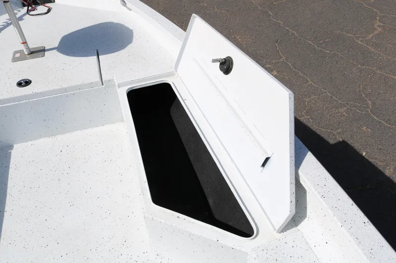 Slide: The Image of Open storage compartment on 2022 Xpress H22B boat deck. - 18