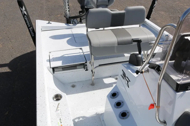 Slide: The Image of 2022 Xpress H22B boat interior with seating and console, featuring modern design elements. - 22