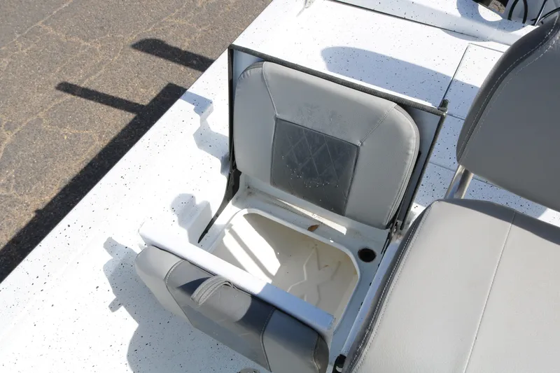 Slide: The Image of Open storage compartment on 2022 Xpress H22B boat seat. - 24