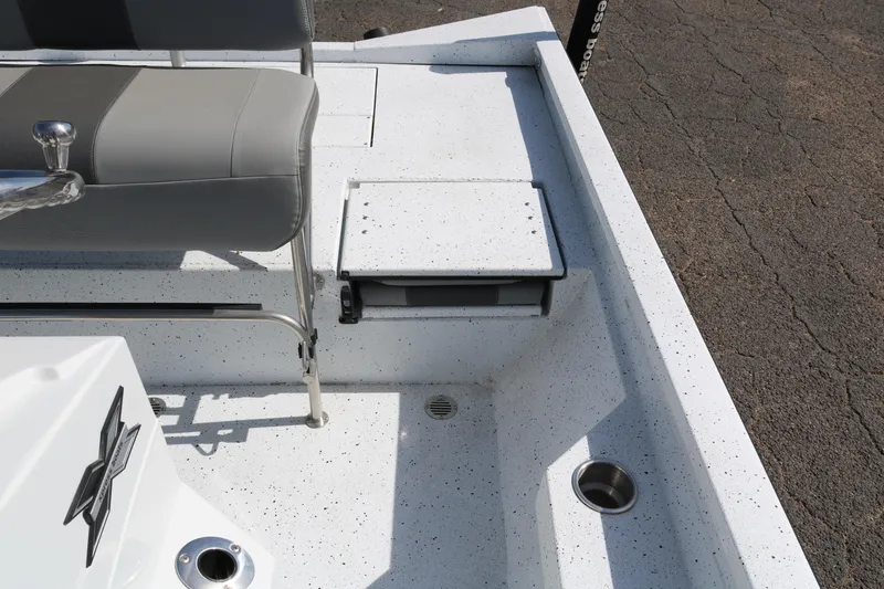 Slide: The Image of 2022 Xpress H22B boat interior with seating and storage compartments. - 25
