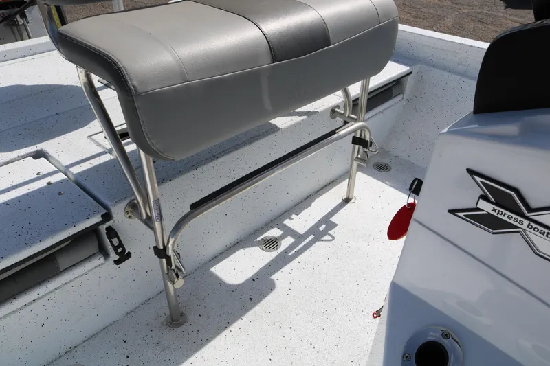 Slide: The Image of 2022 Xpress H22B boat interior with seating and storage compartments. - 28