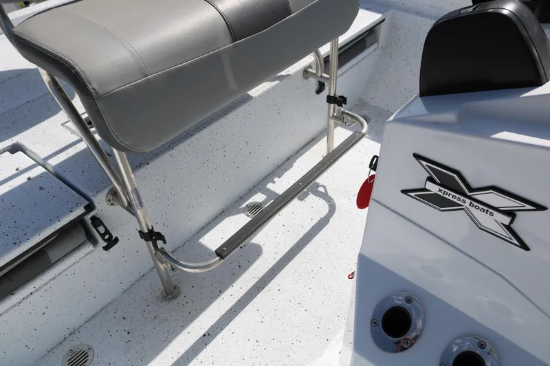 Slide: The Image of 2022 Xpress H22B boat interior with seating and console details. - 29