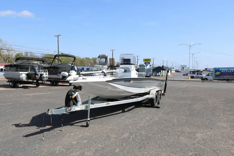 Slide: The Image of 2022 Xpress H22B boat on trailer in parking lot, clear sky background. - 3
