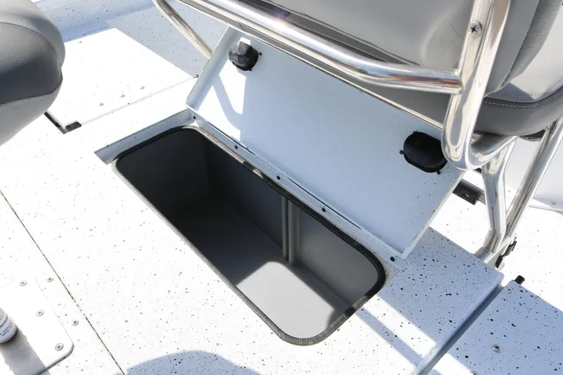 Slide: The Image of 2022 Xpress H22B boat storage compartment with open lid, showcasing interior space. - 31