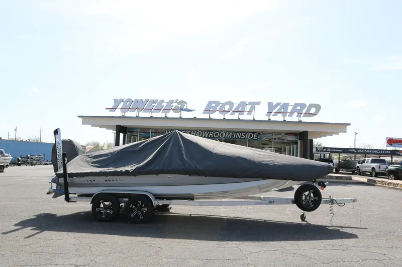 Slide: The Image of 2022 Xpress H22B boat covered, parked at a dealership. - 37