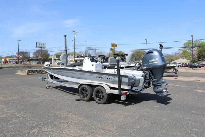 Slide: The Image of 2022 Xpress H22B boat with Yamaha engine on trailer in parking lot. - 5