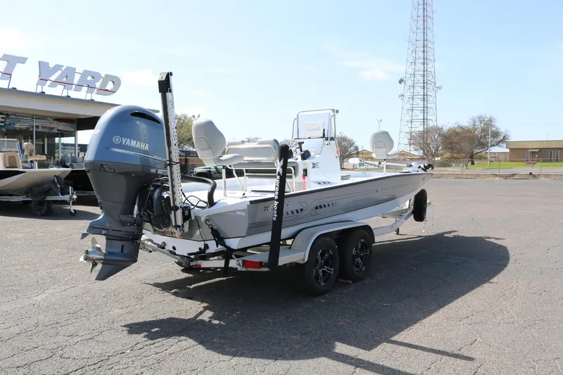 Slide: The Image of 2022 Xpress H22B boat with Yamaha engine on trailer in parking lot. - 7