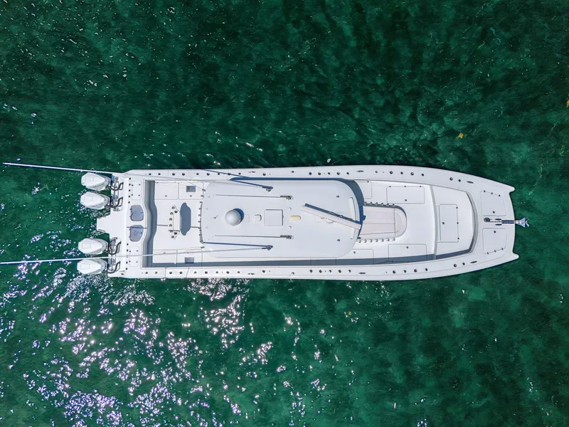 Slide: The Image of Aerial view of 2023 Freeman 47 boat on clear green water. - 16