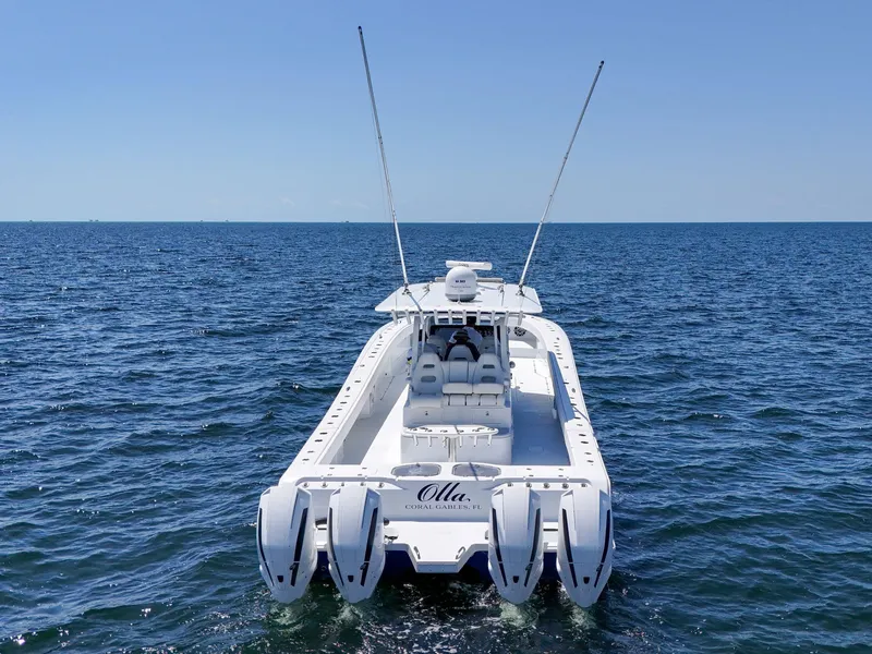 Slide: The Image of 2023 Freeman 47 boat on open sea, featuring four powerful engines. - 17