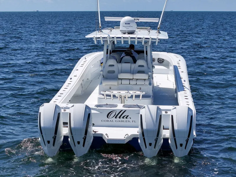 Slide: The Image of 2023 Freeman 47 boat with four engines on open water. - 18