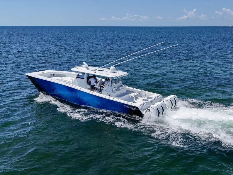 Slide: The Image of 2023 Freeman 47 boat cruising on open ocean waters. - 23