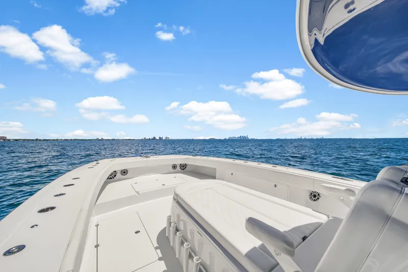 Slide: The Image of 2023 Freeman 47 boat on open sea under clear blue sky. - 27