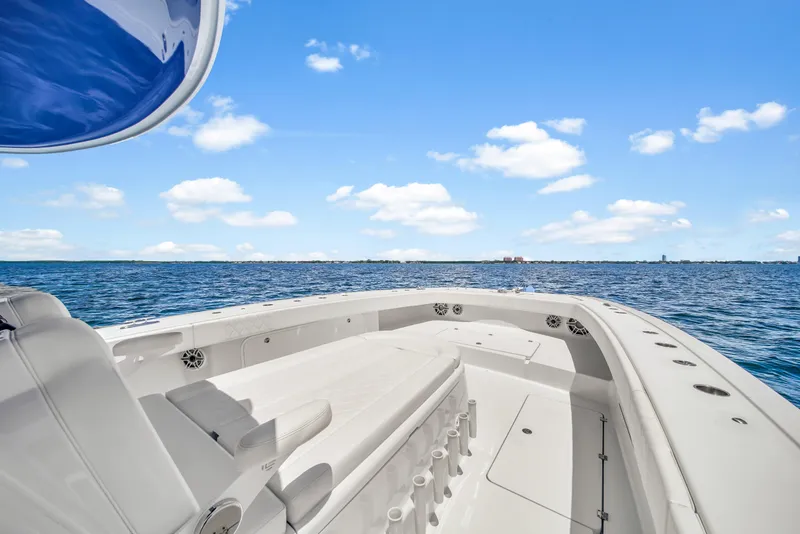 Slide: The Image of 2023 Freeman 47 boat on open sea under clear blue sky. - 31