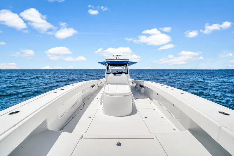 Slide: The Image of Freeman 47 boat on open sea under blue sky, 2023 model. - 32